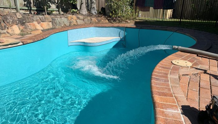 Formed concrete Exotic Pool with Aqualux Cayman