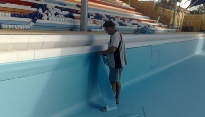 During: Michael trimming the pool liner to shape