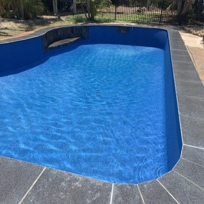 Formed concrecte Exotic Pool with Aqualux Costa Rica and Black Porcelain Black Tile Coping